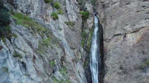 Epic Waterfall Cascading Down Rocky Cliffside in Remote Himalayan Valley wi.. Stock-Footage 345731137