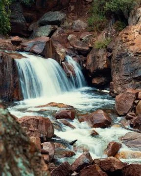 Epic waterfall during the summer while hiking at a national park 스톡 사진