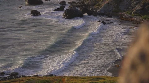 Epic Waves crashing on a secluded beach on the California Pacific coast sunset Stockbeeldmateriaal 279752800