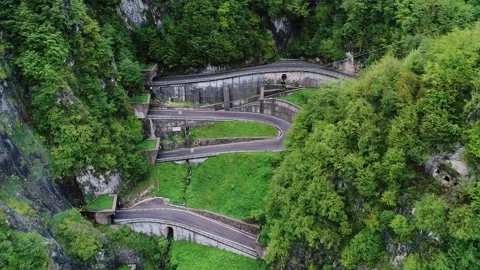 Epic Winding San Boldo Pass Road Cutting Through Lush Green Mountains In Italy Stock Footage 308446708