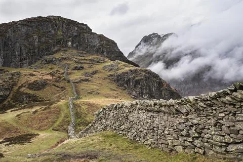 Epic Winter landscape image of view from Side Pike towards Langdale pikes wit Stock Photos