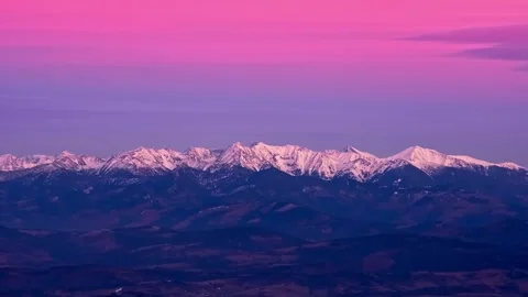 Epic Winter Mountain Range Timelapse in Pastel Sunset Glow Video stock 325435875