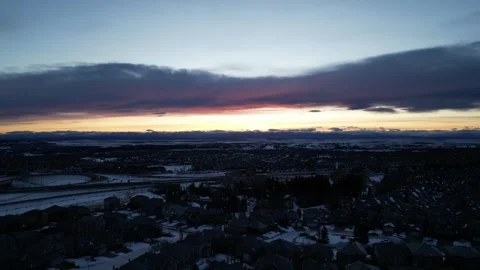 Epic winter sunset over the Rocky Mountains (Aerial, Ascent, Moustache Cloud) Stock Footage 318265859