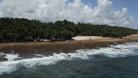 Epic zoom as blue ocean waves crash at Siargao rock pools 4K Drone Footage Stock Footage 102870596