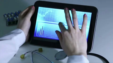 Epidemiologist investigating patterns of disease, comparing statistics on tablet Stock Footage 60843848