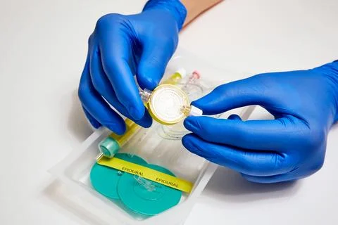 Epidural filter in the doctor's hands. Preparing for epidural anesthesia Stock Photos