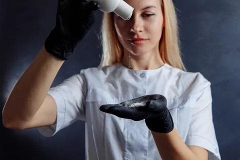 The epilation master prepares for the procedure. Stock Photos