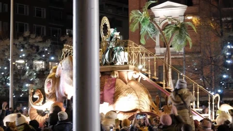 Epiphany Three Kings Parade float with performers, palm trees, and illuminated Stock Footage 300957180