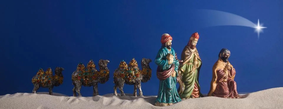 Epiphany. Three Wise Men and decorated camels Stock Photos