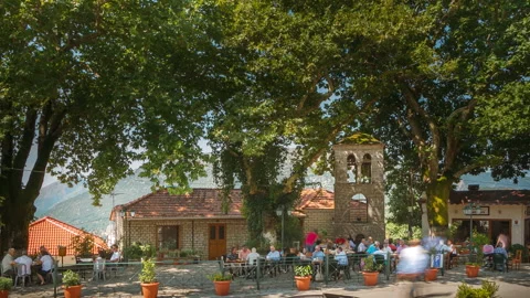 Epirus, Greece – 2015, Aug 15: People at the village square - 2K 30fps Stock Footage 322211509