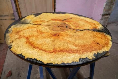 Epoxy resin round table in workshop Stock Photos