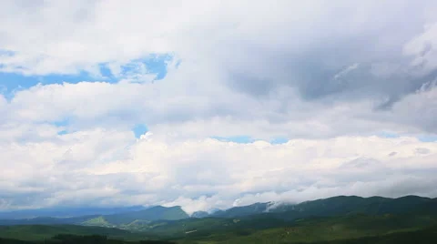 Equal movement of clouds in mountains sky. Time lapse Stock Footage 41726986