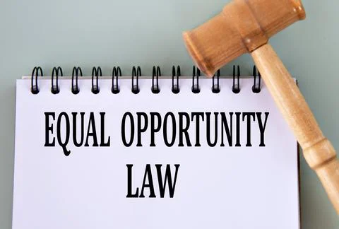 EQUAL OPPORTUNITY LAW - words in a notebook on a gray background with a judge Stock Photos