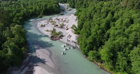 Equestrian group cross a mountain river - drone shot Stock Footage 170567365
