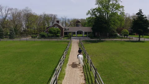 An equestrian heading back to his ranch 動画素材 133290823