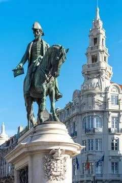 Equestrian statue of King Pedro IV Liberdade Square and the monument to Ki... Stock Photos