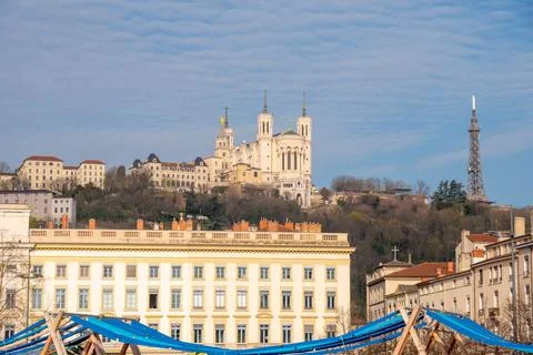 Equestrian statue in Lyon's Bellecour square with Basilica of Notre-Dame de.. Stock Photos