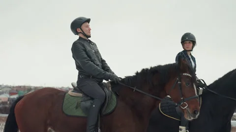 Equestrians training outdoors. Two riders receiving instruction outside during 動画素材 333315350