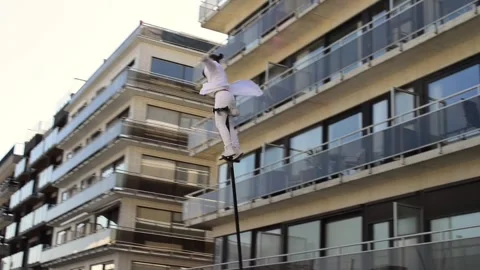 Equilibrist Swaying pole man on a town square Blankenberge Stock Footage 309316312