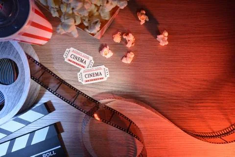 Equipment and elements of cinema on table colored lights top Stock Photos