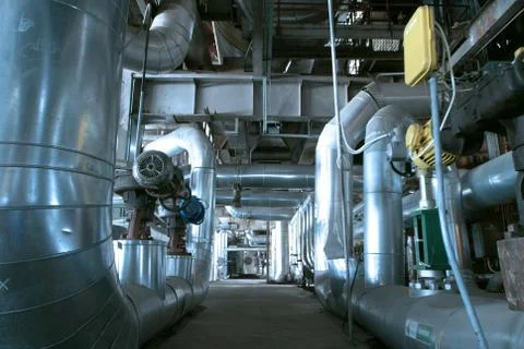 Equipment, cables and piping as found inside of  industrial powe Stock Photos