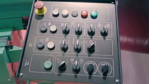 Equipment control panel with many buttons, switches and an emergency stop button Video stock 333344545