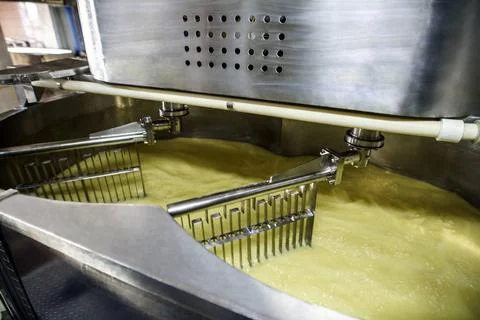 Equipment at dairy processing plant at work Equipment at dairy processing ... Stock Photos