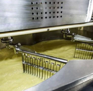 Equipment at dairy processing plant at work Equipment at dairy processing ... Stock Photos