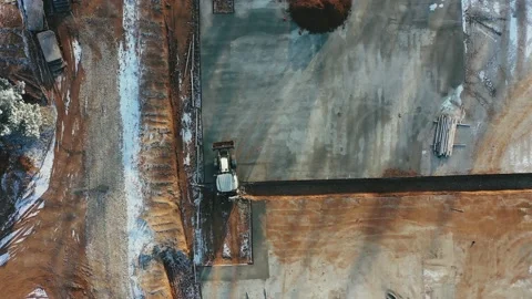 Equipment drives into the foundation of the future building Stock Footage 143775271