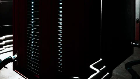 Equipment in an industrial setting with pipes and connections visible Stock Footage 342807239