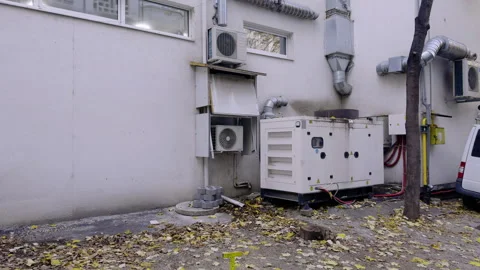 Equipment installation process showing air conditioning units and generator Stock Footage 327851611