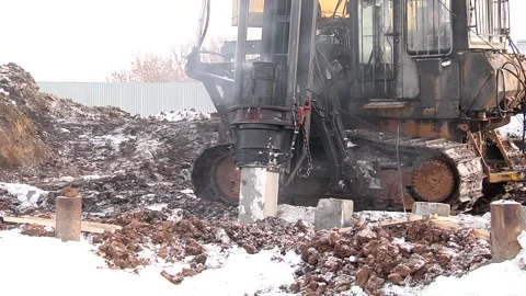 Equipment for installing piles in ground Stock-Footage 160354860