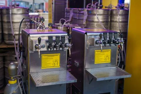 Equipment for pouring different types of drinks connected to barrels of drink Stock Photos