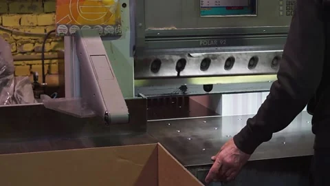  Equipment in the printing house. Cutting of printed products. Stock Footage 166680098