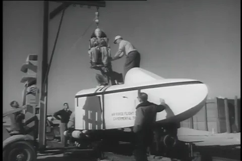 Equipment specialist fits dummy to eject at 800 mile per hour - 1956 Stock Footage 99085655