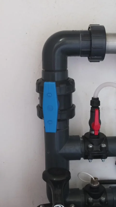 Equipment in a swimming pool technical room with filter, plastic pipes, and valv Stock Footage 312019027