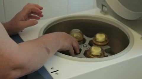 Equipment for tuberculosis analysis, technician puts specimens and close device. Stock Footage 50263953
