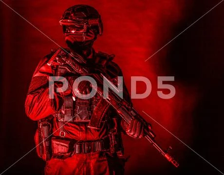Equipped elite forces soldier low key portrait Stock Photos