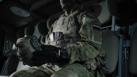 Equipped special forces soldier in an armored military vehicle Stock Footage 327353059