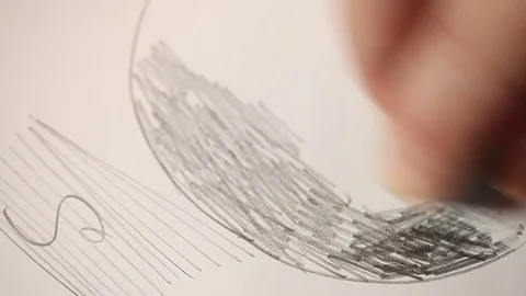 The eraser wipes the drawing with a simple pencil. Hand close up Stock Footage 73447342