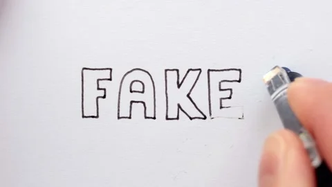 Erasing handwritten word Fake. Stock Footage 132296197