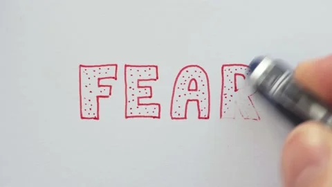 Erasing handwritten word Fear. Stock Footage 132297441