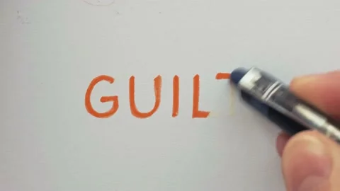 Erasing handwritten word Guilt. Stock Footage 132298233