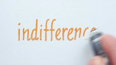 Erasing handwritten word indifference. Stock Footage 132302405