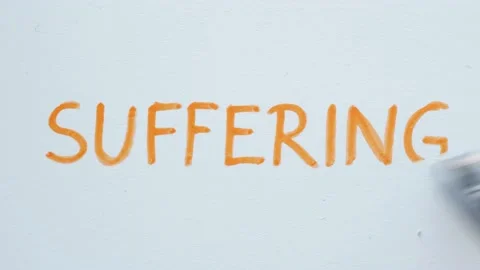 Erasing handwritten word Suffering. Stock Footage 132305678