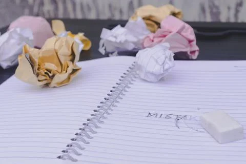 Erasing Mistake on notepad. Learning, wrong, blooper, regret sayings backgrou 스톡 사진