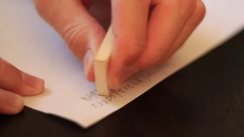 Erasing wtitten numbers with rubber 스톡 동영상 70516696