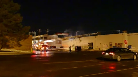 Erected ladder during the night at structure fire Stock Footage 139663805