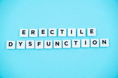 Erectile Dysfunction letter isolated on blue background Stock Photos