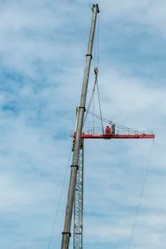 Erecting a Tower Crane. Stock Photos
